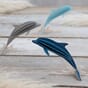 lovi-dolphins-on-gray-wood-with-pampas-grass.jpg
